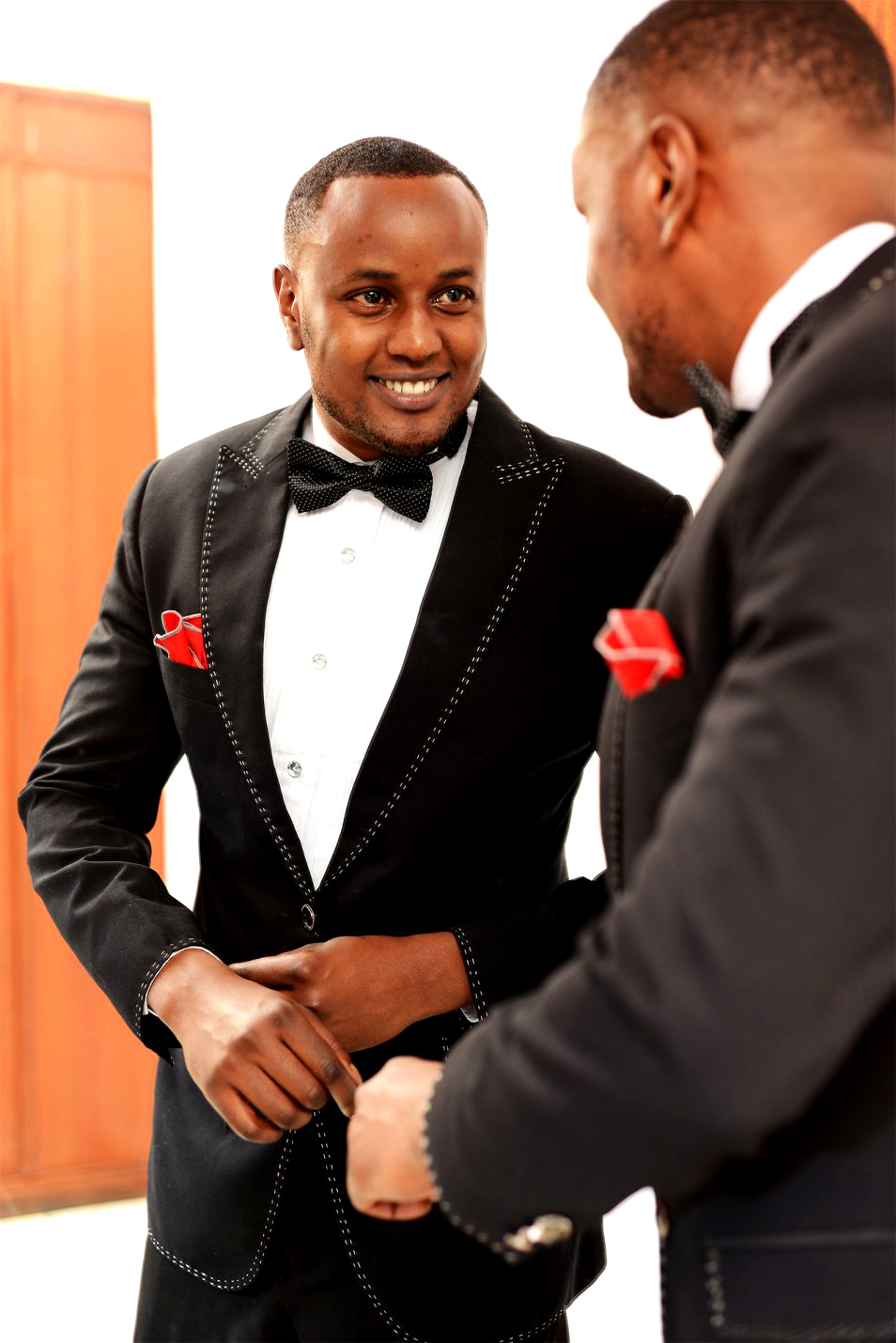 A Simple Wedding Attire With A Cream Color Jacket And A Bow Tie