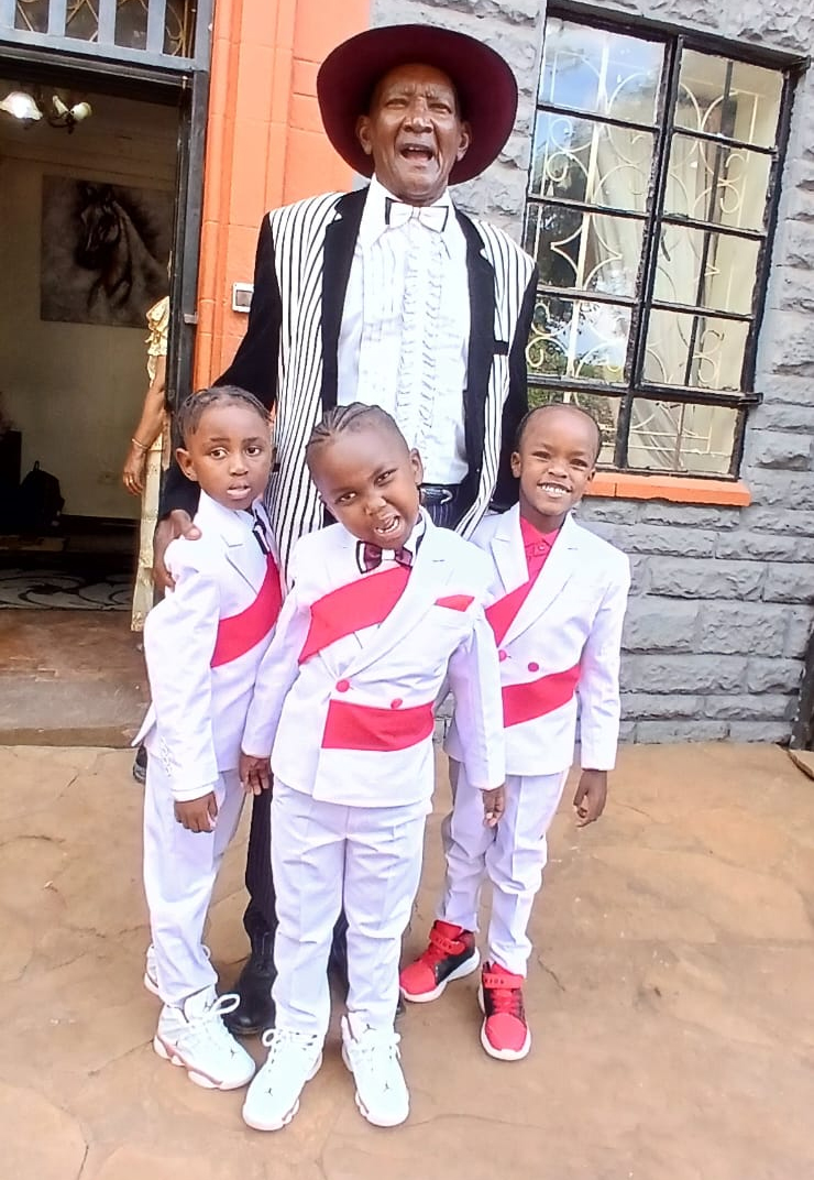 page boy white Kenyan wedding suits